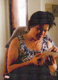 The Vietnamese Lady looking at he child photos